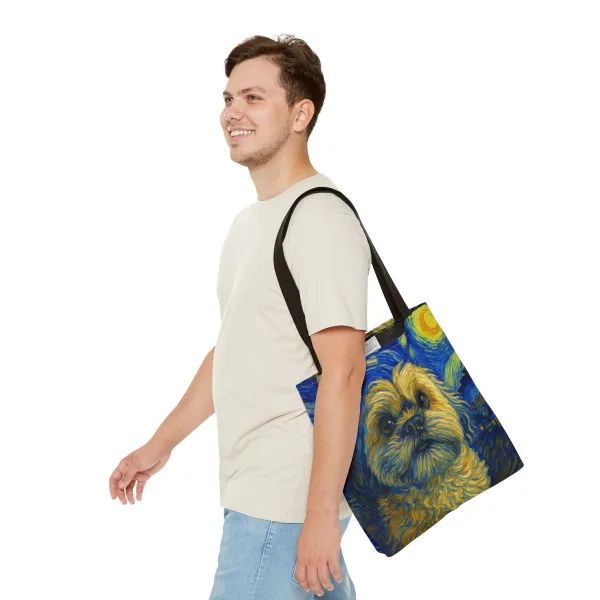A person carrying a tote bag printed with a Starry Night pet portrait